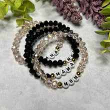 Load image into Gallery viewer, All four bracelets laying on surface