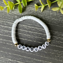 Load image into Gallery viewer, white bracelet says graduate